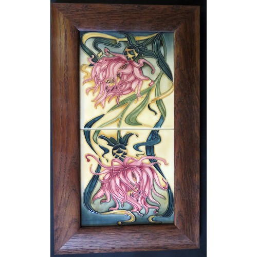 12 - A Pair of Modern Moorcroft Floral Tiles in an oak frame, 40x24cm
