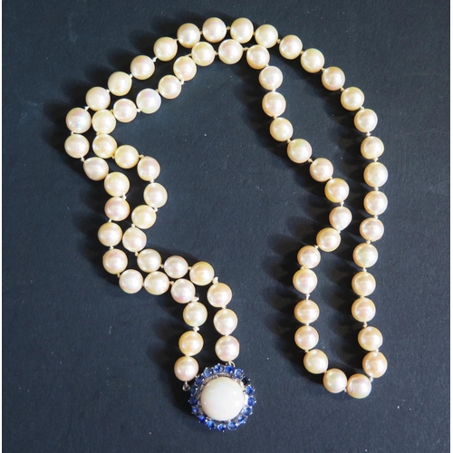 893 - A Single Strand Pearl Necklace with a large white opal and blue stone pendant, the 15.5mm singlet op... 