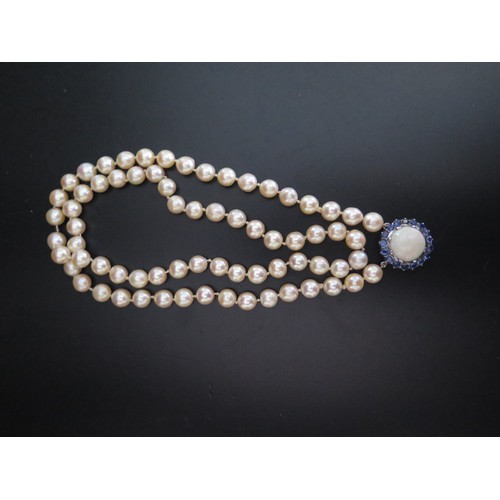 893 - A Single Strand Pearl Necklace with a large white opal and blue stone pendant, the 15.5mm singlet op... 