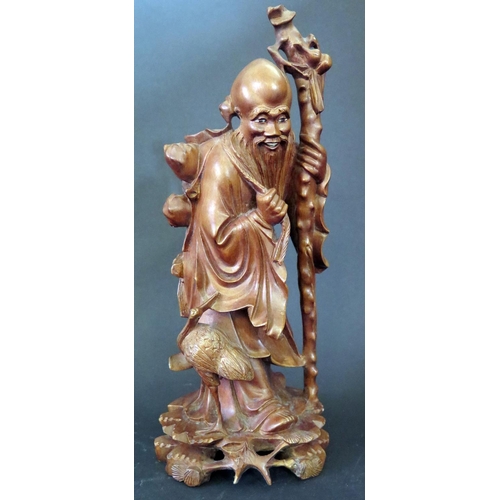 1156 - A Chinese Carved Wooden Immortal, 30cm high