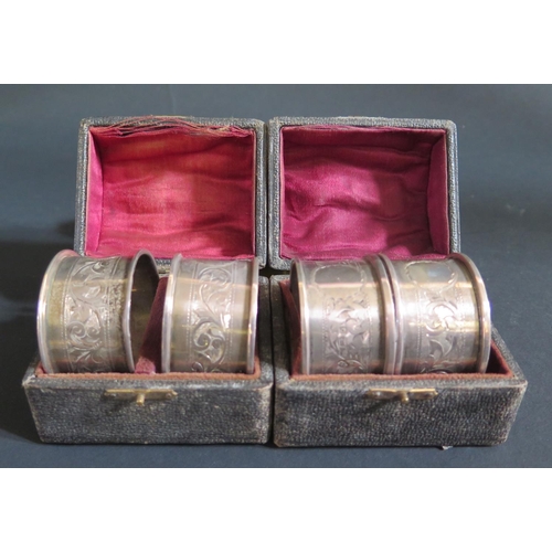 1015 - Two George V Cased Pairs of Silver Napkin Rings with chased acanthus leaf decoration, Birmingham 191... 