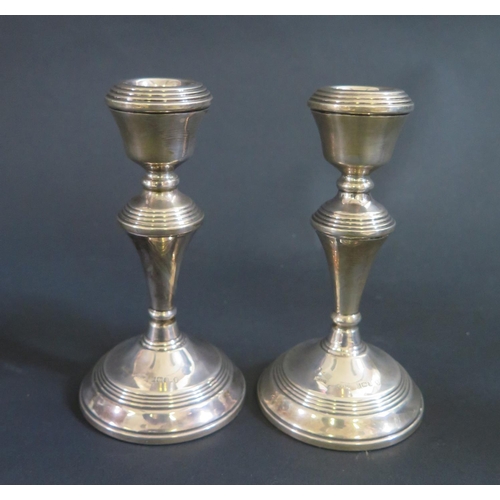 1019 - A Pair of Modern Loaded Silver Candlesticks, Birmingham 1977, B&Co., 14cm