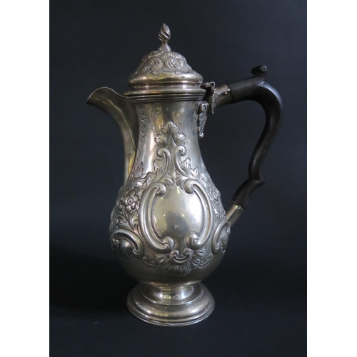 1021 - An Edward VII Silver Coffee Pot with repoussé foliate a scroll decoration, Chester 1906, George Nath... 