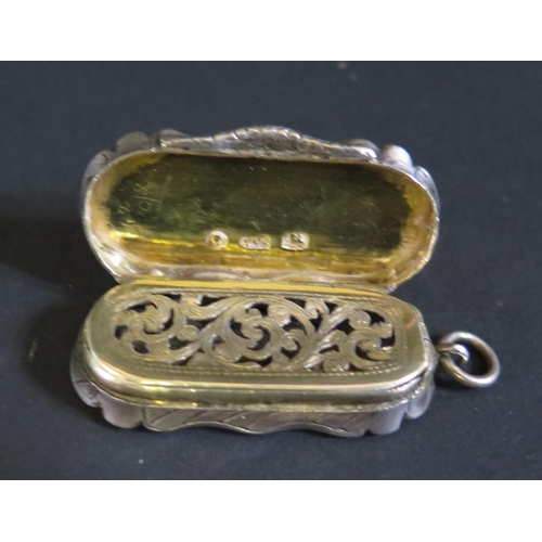 1073 - A Victorian Silver Vinaigrette with chased decoration, Birmingham 1859, Aston & Son, 41mm without ri... 