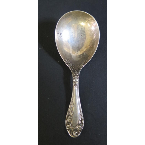 1074 - An Edward VII Silver Caddy Spoon with rose decoration, Birmingham 1905, Levi & Salaman, 13.8g