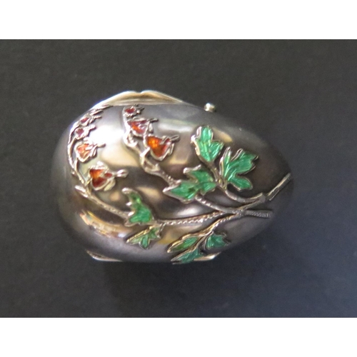 1076 - A .900 Continental Silver and Floral Enamel Hinged Egg with gilt interior, flower mark, 40mm tall, 1... 