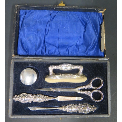 1093 - A Cased Birmingham Silver Manicure Set. Box A/F