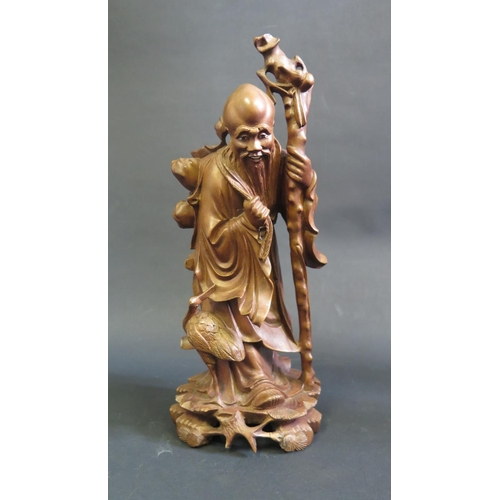 1156 - A Chinese Carved Wooden Immortal, 30cm high