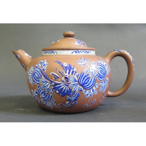 1163 - A Chinese Yixing Terracotta Teapot decorated in blue enamels, 10.5cm high