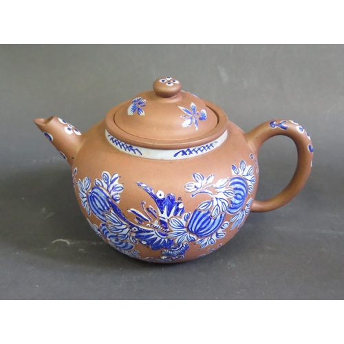 1163 - A Chinese Yixing Terracotta Teapot decorated in blue enamels, 10.5cm high