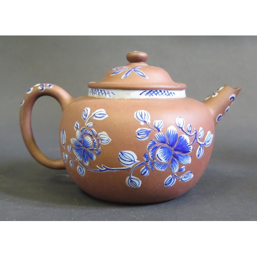 1163 - A Chinese Yixing Terracotta Teapot decorated in blue enamels, 10.5cm high