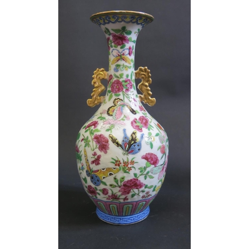 1164 - An 18th Century Chinese Famille Verte Vase, drilled and converted to a lamp, 18cm. Rim cracked. A/F
... 