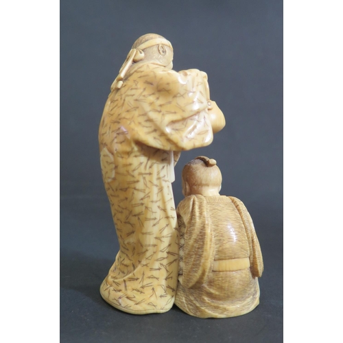 1173 - An Antique Oriental Ivory Okimono of a lady with kettle and kneeling man feeding a tortoise from a b... 