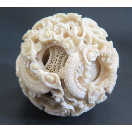 1174 - An Antique Chinese Carved Ivory Puzzle Ball carved with dragons and with approximately 15 layers (c.... 