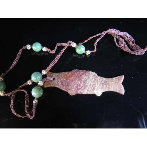 1191 - A Chinese Jadeite Bead and Seed Pearl Necklace with a carved hardstone pendant