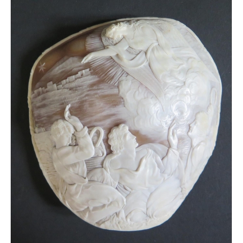 1199 - A 19th Century Carved Shell Cameo decorated with a Nativity Scene of The Angle Gabriel pointing out ... 