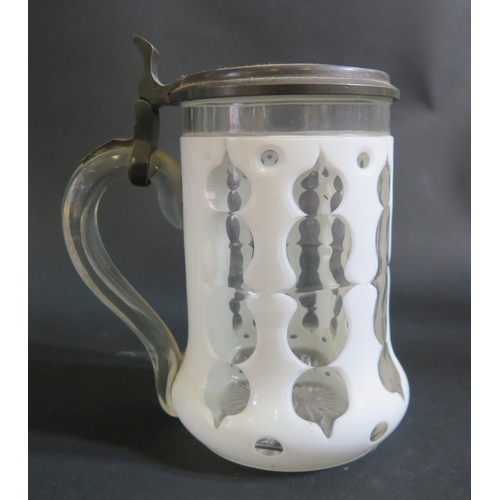 1201 - A 19th Century Bohemian Opaque and Slice Cut Glass Tankard with Porcelain Cover painted with a half ... 