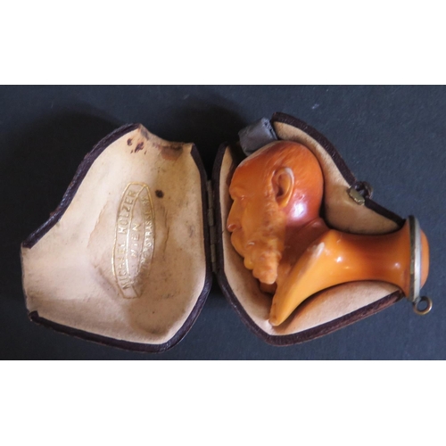 1215 - A Cased Meerschaum Pipe Bowl in the form of a monarch?, by Michael Holzer, c. 5cm high