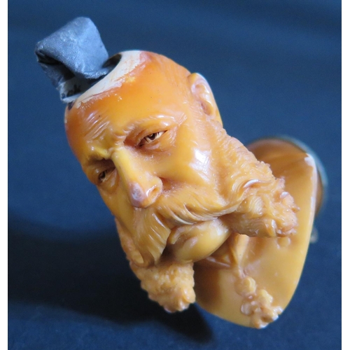 1215 - A Cased Meerschaum Pipe Bowl in the form of a monarch?, by Michael Holzer, c. 5cm high