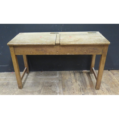 1345 - A Twin School Desk, the brass inkwell slides stamped Andrew Bentley Ltd., 101cm diam.