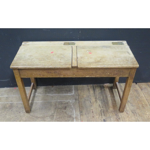 1345 - A Twin School Desk, the brass inkwell slides stamped Andrew Bentley Ltd., 101cm diam.