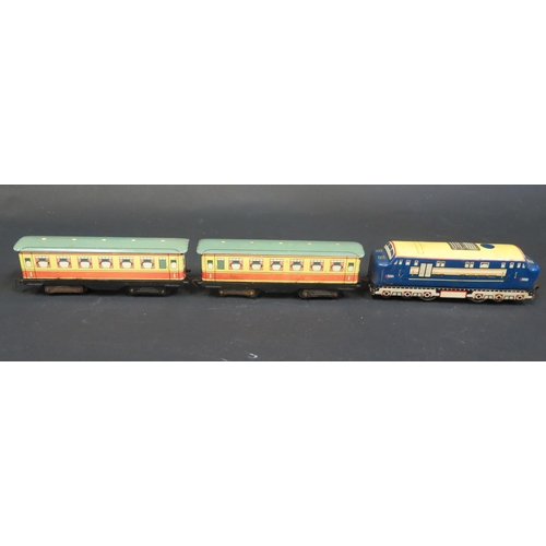 326 - An Electric Brimtoy Tinplate D5001 Diesel Locomotive and Carriages. Carriages are sun faded on one s... 