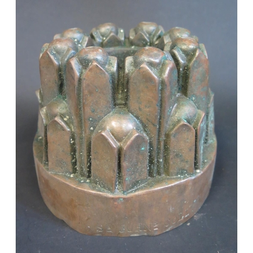 352 - A 19th Century Castellated Copper Jelly Mould stamped St. John's Coll., 14.5cm diam.