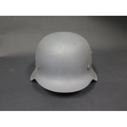 495 - A WWII German Helmet, repainted with SS decals, stamped 3453