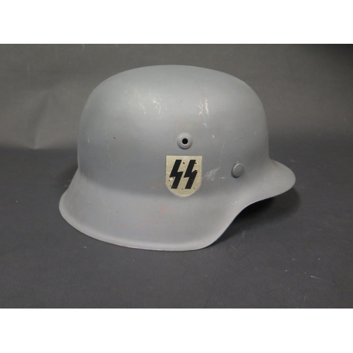 495 - A WWII German Helmet, repainted with SS decals, stamped 3453