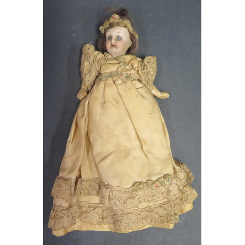 621 - A German Porcelain Headed Doll with composite arms and legs