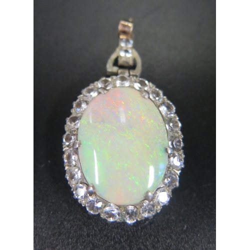 874 - A Large White Opal Pendant with white stone surround, c. 46mm drop