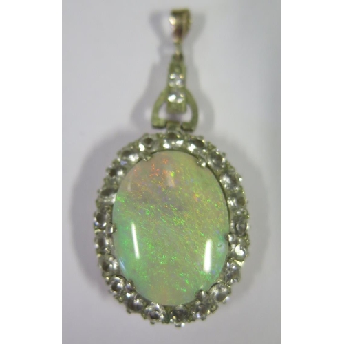 874 - A Large White Opal Pendant with white stone surround, c. 46mm drop