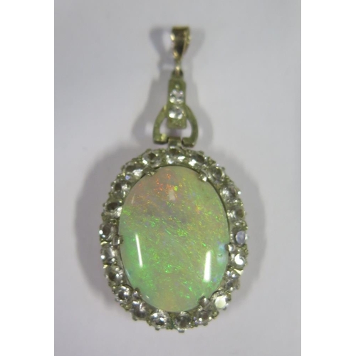 874 - A Large White Opal Pendant with white stone surround, c. 46mm drop