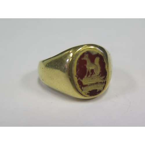 877 - A High Carat Gold Seal Ring decorated with a canine and 'LIBERIE' in a red hardstone, size N.5, 10.4... 