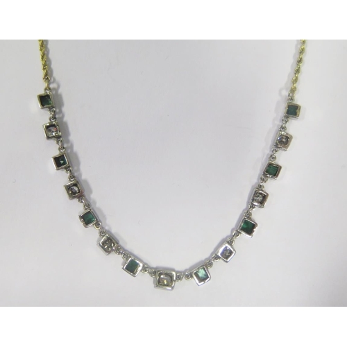 880 - A 15ct Gold, Emerald and Diamond Necklace, 55cm, 6.0g (length of stone set area c. 10cm, diamonds c.... 