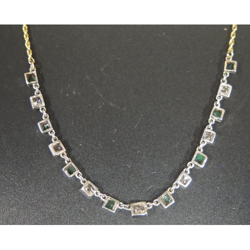 880 - A 15ct Gold, Emerald and Diamond Necklace, 55cm, 6.0g (length of stone set area c. 10cm, diamonds c.... 