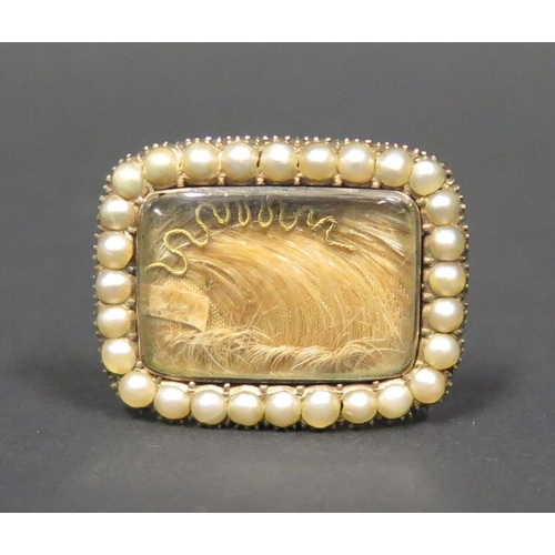 881 - A Georgian Gold Memorial Ring set with lock of hear, gold thread and bordered by pearls, size A, 5.1... 