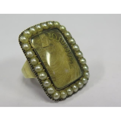 881 - A Georgian Gold Memorial Ring set with lock of hear, gold thread and bordered by pearls, size A, 5.1... 