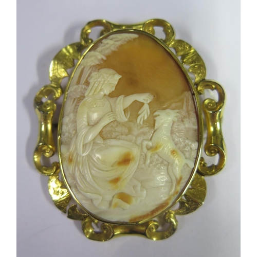 890 - A Nineteenth Century Shell Cameo Brooch decorated with seated lady and goat in a rural setting and i... 