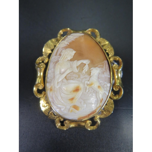 890 - A Nineteenth Century Shell Cameo Brooch decorated with seated lady and goat in a rural setting and i... 