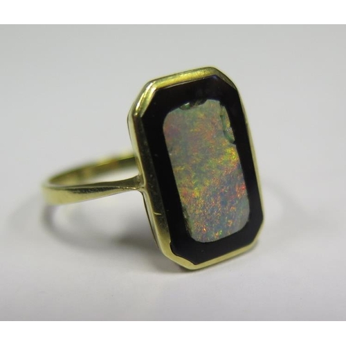 891 - An 18ct Gold, Opal and Black Onyx Ring, size N.5, 2.8g