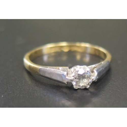 894 - An 18ct Gold and Platinum Diamond Set Solitaire Ring, size M.5, 2.3g (EDW .2ct)