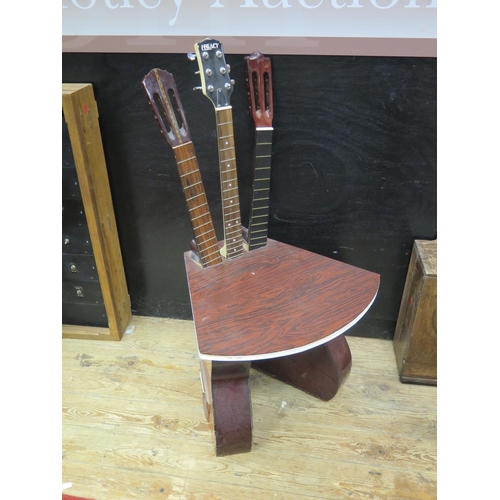 1327 - A Unique Guitar Chair, the base formed from two guitar bodies and the back by three necks. According... 