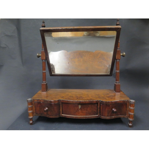 1560 - A 19th Century Mahogany Shape Front Swivel Toilet Mirror with three frieze drawers, 59.5cm wide