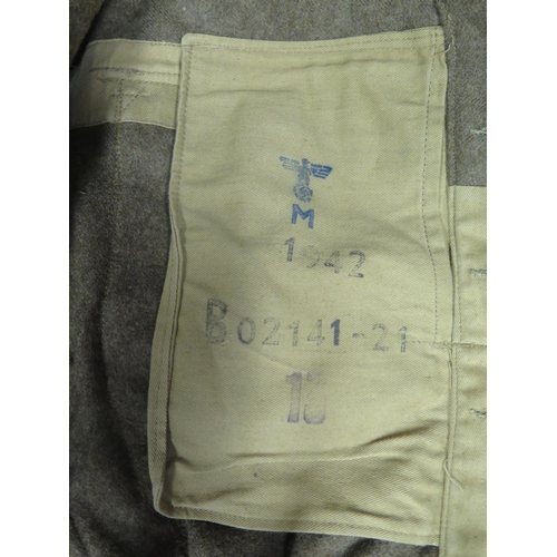 490 - A WWII German Army Jacket, stamped with Eagle and Swastika stamp and with Royal Navy buttons