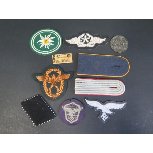 503 - A Collection of German Military Cloth Badges including Edelweiss, Flying Technical Trade, paper labe... 