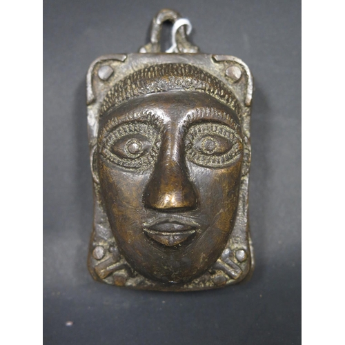 515 - A Small West African Bronze Mask Decoration, 11.5x7cm