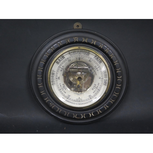 536 - A Victorian Aneroid Barometer in an ebonised case, patent no. 2526 applied for 1888, 23cm diam.