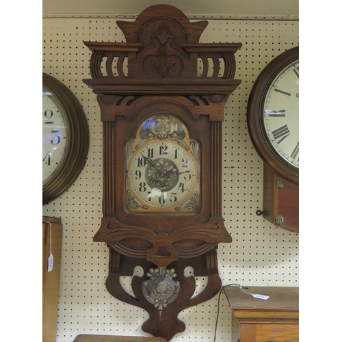 539 - An Art Nouveau Oak Cased Drop Pendulum Wall Clock, c. 90 tall, running