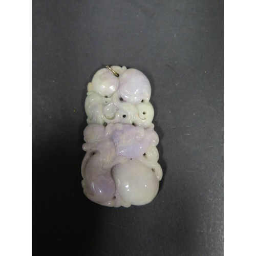 1171b - A Chinese Carved Lavender Jade Pendant decorated with an animal and folliage, 65mm